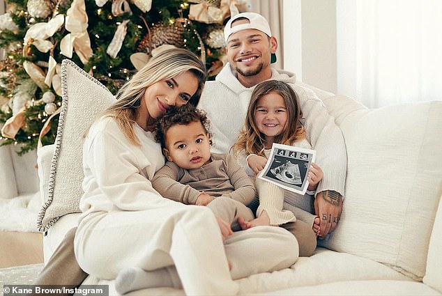 Kane Brown has revealed that he underwent a vasectomy after discovering his wife was pregnant with their third child;  pictured with his daughters Kingsley Rose, four, and Kodi Jane, two.