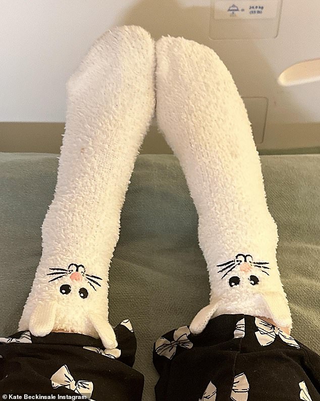 The two snaps show a pair of legs wearing fuzzy white socks with bunny faces, as the Underworld star captioned the post: 'Happy Easter.'