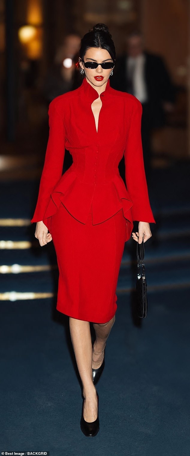 Kendall Jenner showed off her impeccable sense of style in a vintage red Mugler peplum dress while hitting the streets of Paris on Friday night.