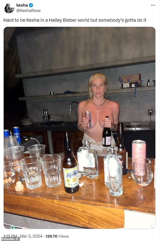 Last week the artist posed topless with a can and a bottle in front of her chest.