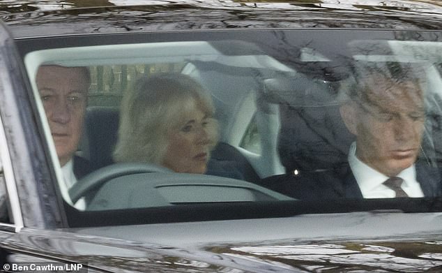 Camilla is seen leaving Clarence House today in a separate car from King Charles