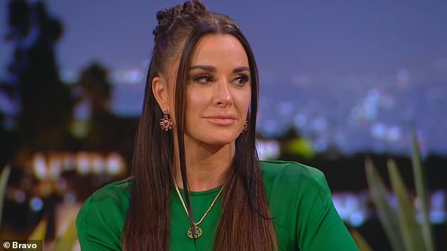 Kyle Richards, 55, shared she was 'curious' about kissing a woman when discussing her steamy cameo in singer Morgan Wade's, 29, music video 'Fall In Love With Me' last year