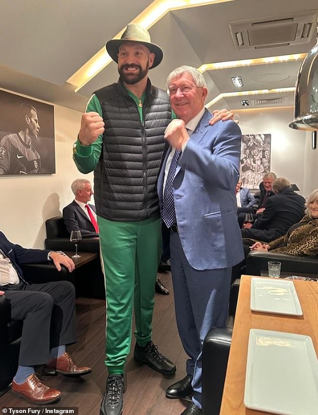 Meanwhile, Tyson Fury (L) rocked a green tracksuit and black vest to mark the day as he posed with Sir Alex Ferguson (R) at the Manchester United vs Liverpool FA cup match