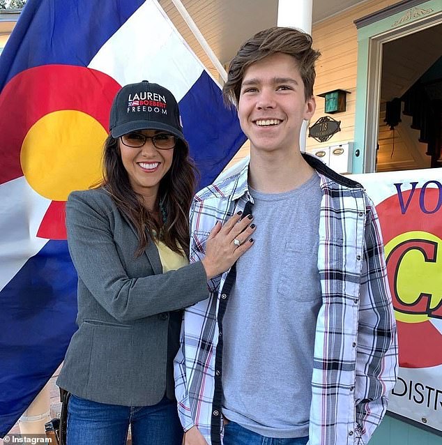 A woman who was allegedly robbed by Tyler Boebert claims the robbery left her without money she had been saving for brain surgery.  Tyler, seen here on the right in 2022, is the 18-year-old son of Lauren Boebert, pictured left.  The Colorado representative has said her son should face consequences for her alleged actions.