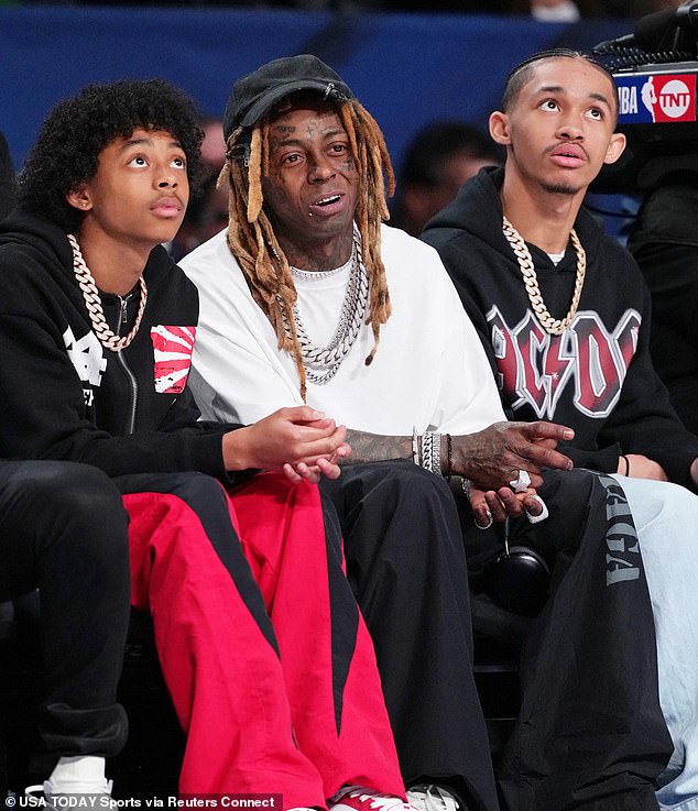 Lil Wayne is seen taking in the NBA All-Star Weekend action with his kids on February 18.