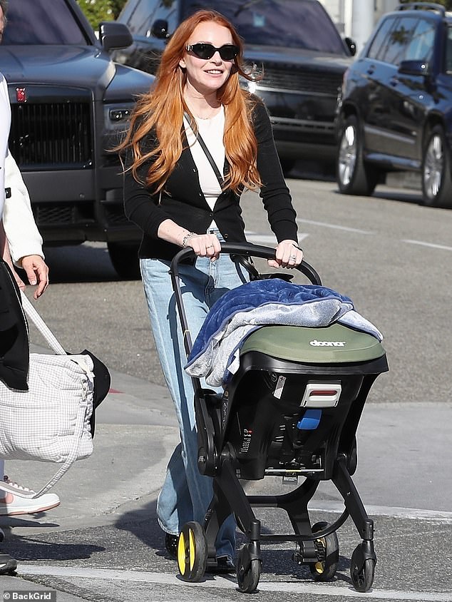 Lindsay Lohan, 37, was a doting mom as she enjoyed a relaxing family outing while grabbing lunch at La Scala in Beverly Hills on Saturday.