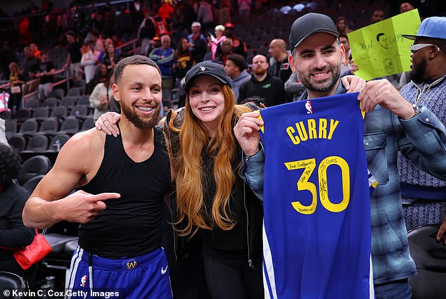 The former Hollywood wild child and her husband, financier Bader Shammas (right), who celebrate their first wedding anniversary on April 3, selected Golden State Warriors guard Stephen Curry (left) and his wife Ayesha Curry, to be his son's godparents.
