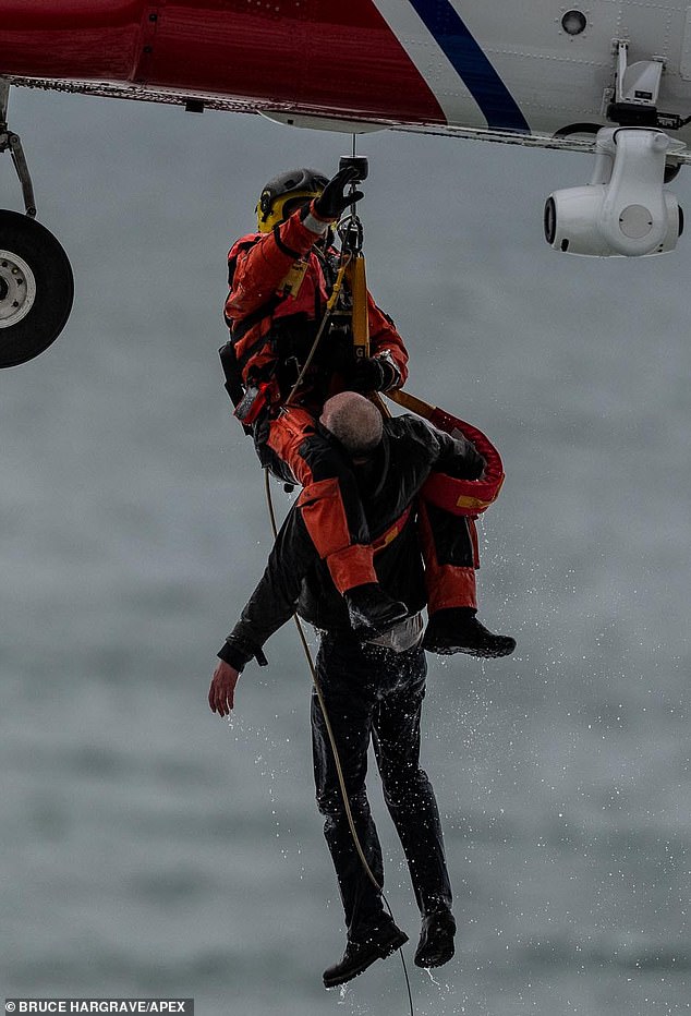 Dramatic footage shows the man being airlifted to safety after becoming trapped on Perranporth beach, Cornwall.  He apparently had fallen off the coastal path.