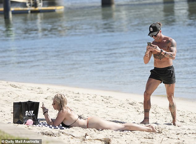 Married At First Sight boyfriend Jack Dunkley was spotted taking racy photos of his girlfriend Tori Adams' butt on a Gold Coast beach date on Wednesday.