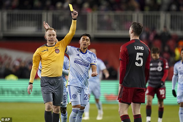Referee Scott Bowman shows a yellow card during Toronto's game against Atlanta in March.