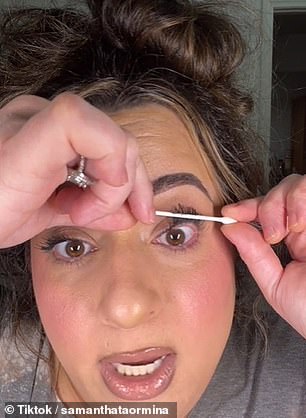 She moved the center of the Q-Tip all the way around her lash line