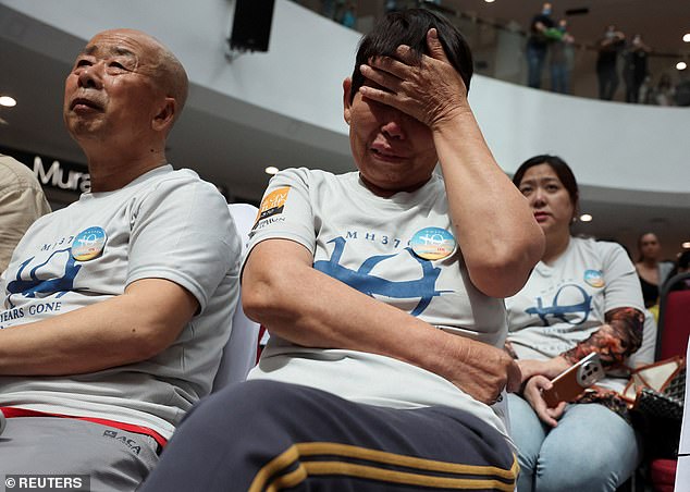 The Malaysian government has thrown its support behind a new proposed search for flight MH370 that disappeared ten years ago this week (pictured, loved ones of the victims at a memorial service in Malaysia)