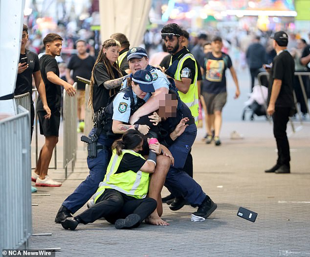 Shocking footage captured the moment police and security tackled a young man to the ground outside the Sydney Royal Easter Show.
