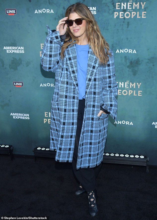 The actress - who recently joined Camila Mendes at a premiere - donned a light blue crew-neck sweater under a plaid trench coat that kept her warm in the chilly New York weather.