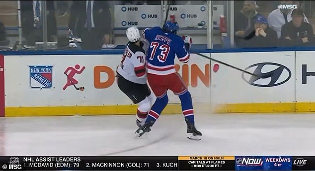 Rangers center Matt Rempe with a chicken wing on the Devils defenseman in the second period.