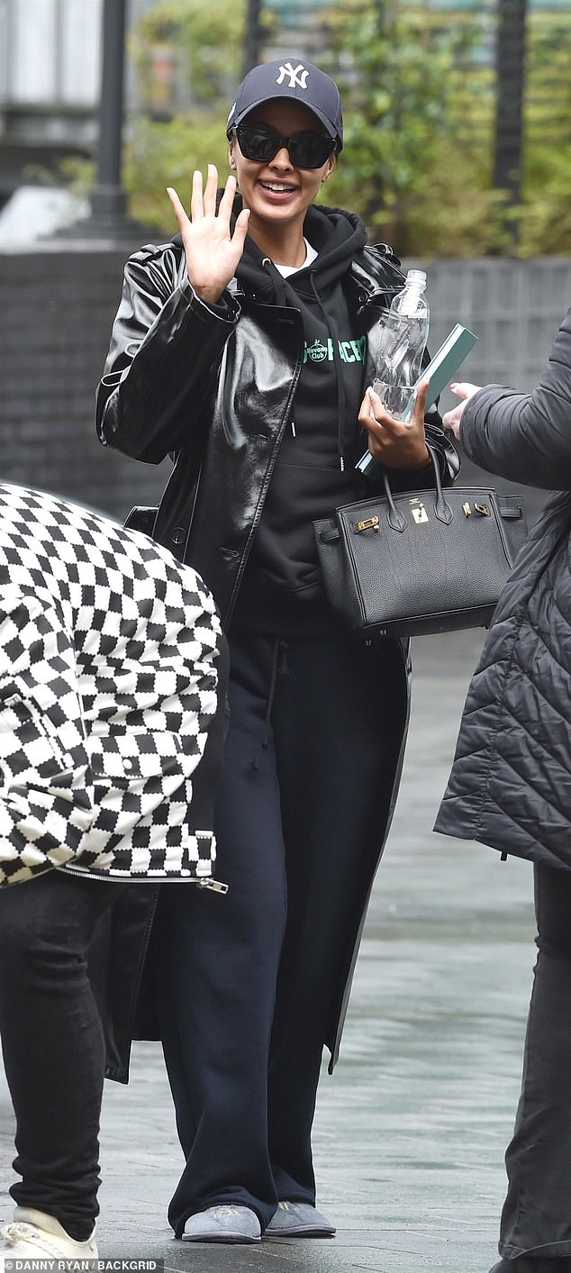 Maya Jama, 29, covered up in a baseball cap as she arrived in Manchester on a casual Thursday, ahead of her stint at Comic Relief