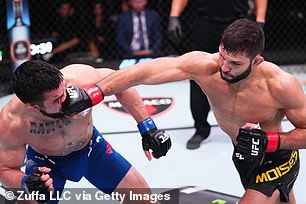 Fight night: Brazil's Thiago Moises slams Mitch Ramirez in their lightweight bout in Las Vegas earlier this month