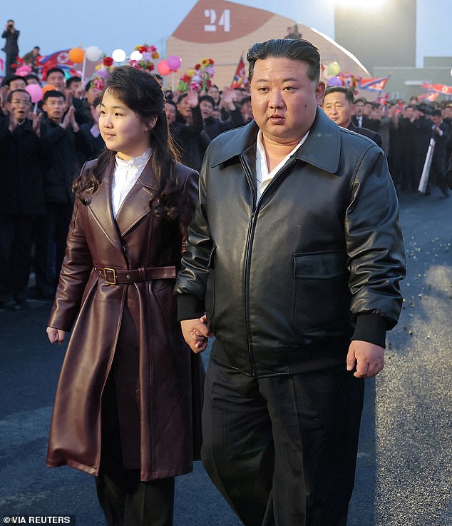 Speculation has begun to rise that Kim Jong Un's daughter Ju Aye could be next in line to take over as leader of North Korea (photo of Kim Ju Aye and Kim Jong Un).