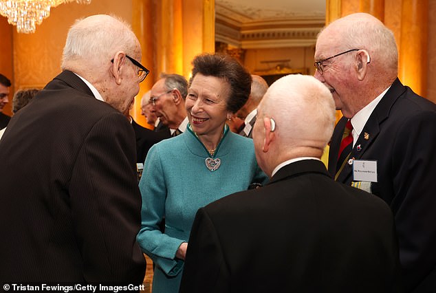 Princess Anne speaks to war veterans at a reception at Buckingham Palace