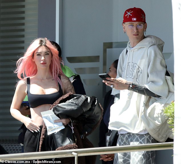 Megan Fox, 37, and her fiancé Machine Gun Kelly, 33, were spotted arriving at an exclusive resort in Mexico on Monday for a sunny getaway.