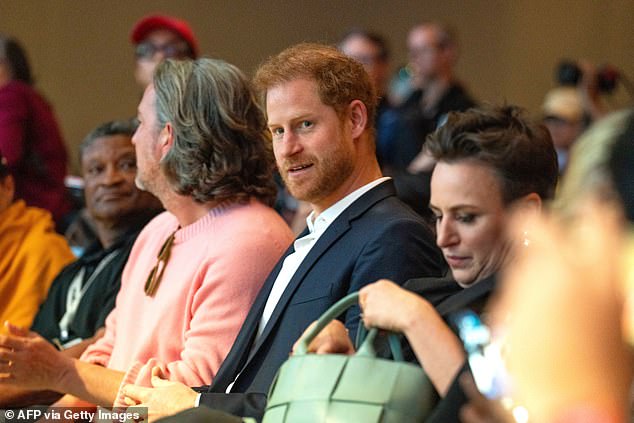 Harry was seen front row to support Meghan, alongside his long-time friend and confidant Markus Anderson.