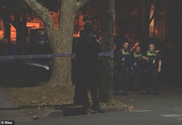 A man was rushed to hospital after he was found in a backyard in Balwyn, Melbourne, with critical injuries (pictured: officers at the scene)