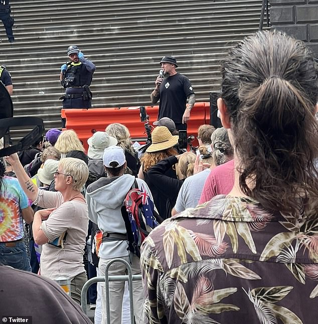 A women's rights protest (pictured) on the steps of State Parliament in Melbourne's CBD has turned violent with altercations between supporters and counter-protesters