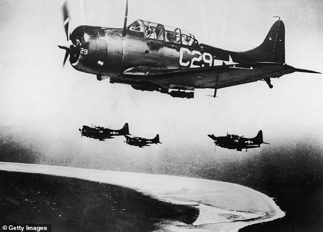 A group of U.S. Navy Douglas Dauntless dive bombers prepare to attack Japanese-held Eniwetok in the Marshall Islands, 1944.