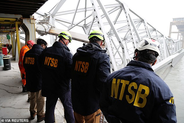 National Transportation Safety Board investigators examining what remains of the Francis Scott Key Bridge