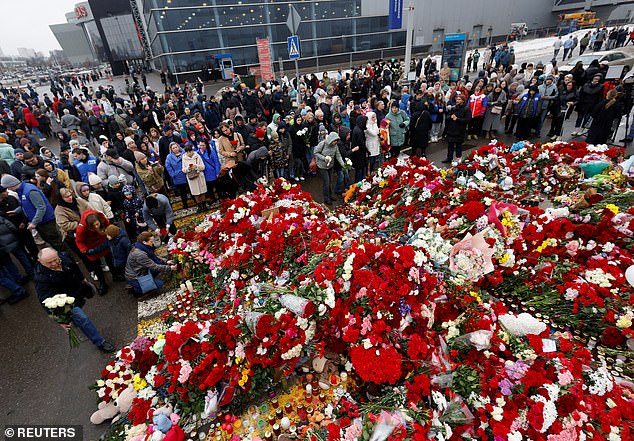 Hundreds of people gathered at the concert hall today to pay their respects and lay flowers as Russia declared a day of national mourning.