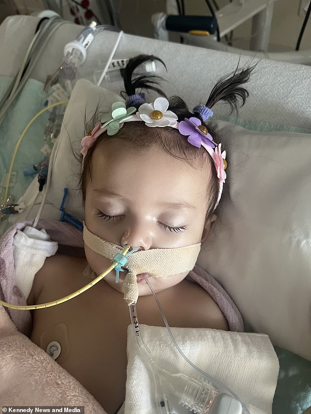 Little Rosantina West (pictured) started wheezing on February 14 and the real cause wasn't discovered until two days later when she was rushed into emergency surgery.