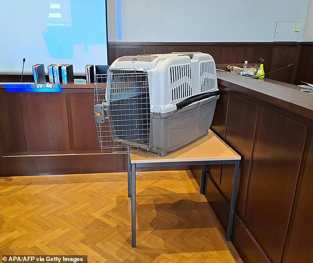 A dog cage displayed in a courtroom at the beginning of a three-day jury trial.  The mother was found guilty of all charges, including attempted murder, yesterday in a court in Krems, northeastern Austria.