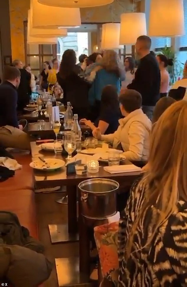 A shocking brawl (pictured) broke out in the middle of a restaurant between a group of women
