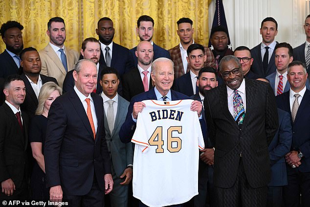 President Biden receives a jersey as he hosts the Astros to celebrate their 2022 title.