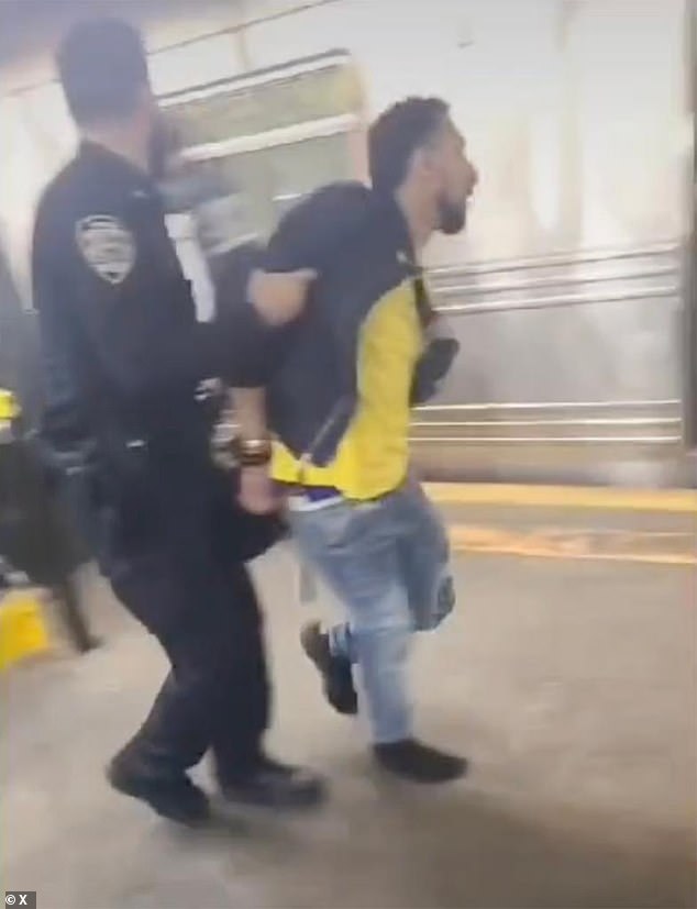 Younece Obuad, 32, (pictured during his arrest), suspected of shooting an aggressive subway rider, will not face charges after Brooklyn prosecutors ruled he acted in self-defense