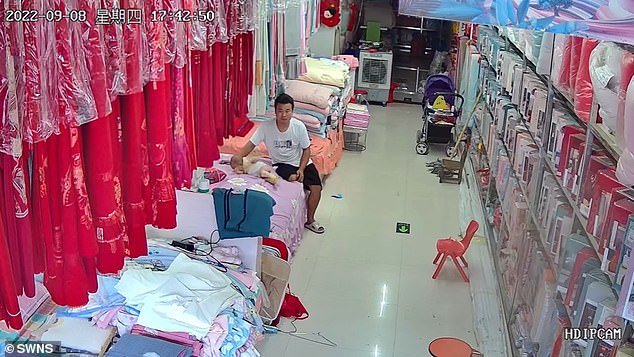 Guo, from Henan, China, was relaxing with her daughter in what appears to be a store before chaos broke out.