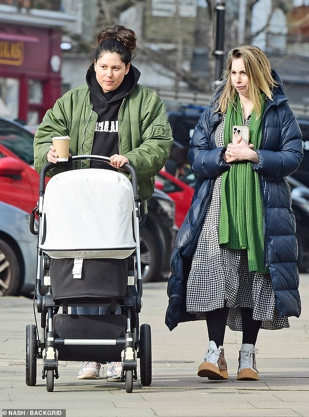 Eliza Doolittle welcomed her first child, and the singer was seen going for a walk with the newborn on Thursday (pictured left with British artist Helen Benigson, right).
