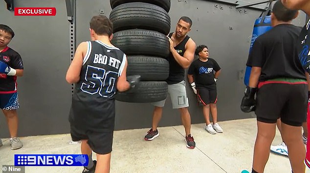 Miso (pictured, center right) began mentoring young people at a gym in Sydney's western suburbs.