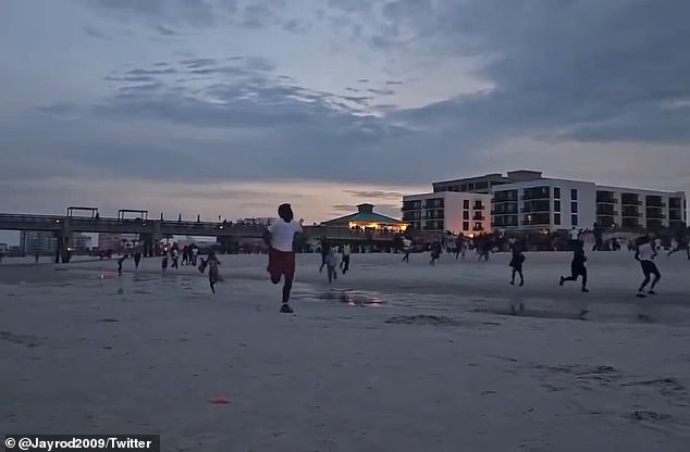 People could be seen running on the beach in Jacksonville to escape gunfire Sunday night in the bar district.