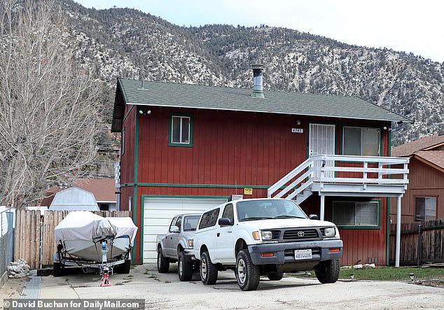 He lives in the town of 3,000 people in a 1,176-square-foot single-family home, seen here, with his wife Laura, after living there for at least a decade