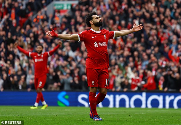 Mo Salah greets the crowd after scoring the goal that returned Liverpool to the top