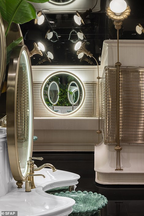 The bathroom walls are decorated with champagne-gold grilles