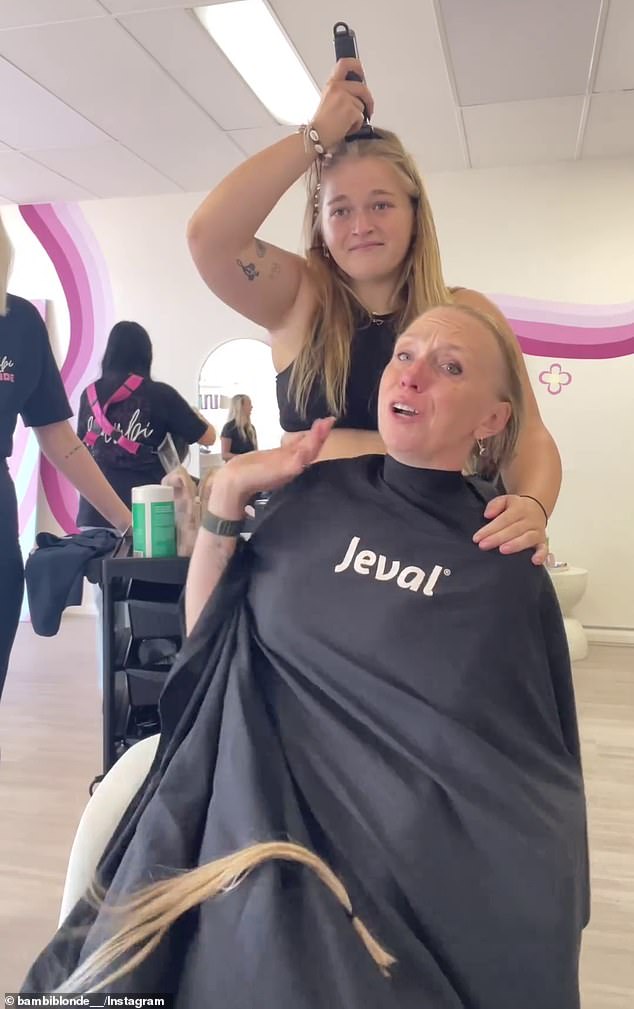 Sophie Mulcahy was about to shave her mother Tracy's head after she was diagnosed with stage four high-grade ovarian cancer, when she suddenly turned the electric shaver on her own hair.