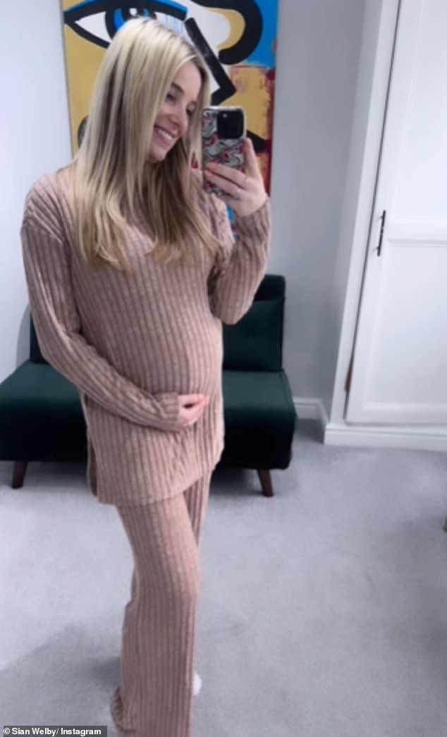 Sian Welby cradled her baby bump as she showed off her 'first load of maternity clothes' via Instagram on Monday.