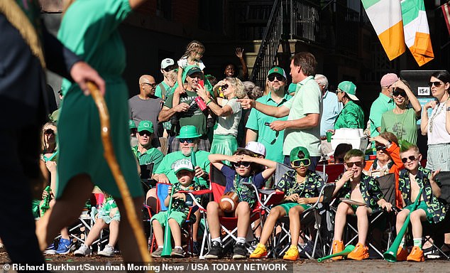 Children watch the annual Savannah St. Patrick's Day Parade on Saturday