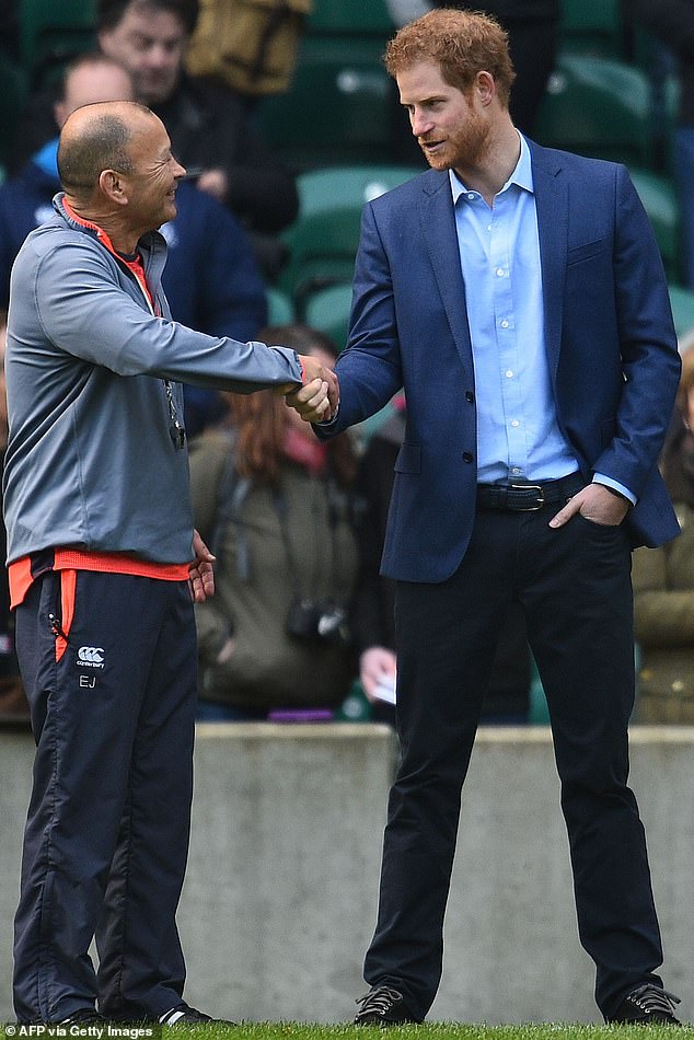Prince Harry (pictured, right) talks to England's Australian coach Eddie Jones (pictured, left) during a team training session at Twickenham in 2017.