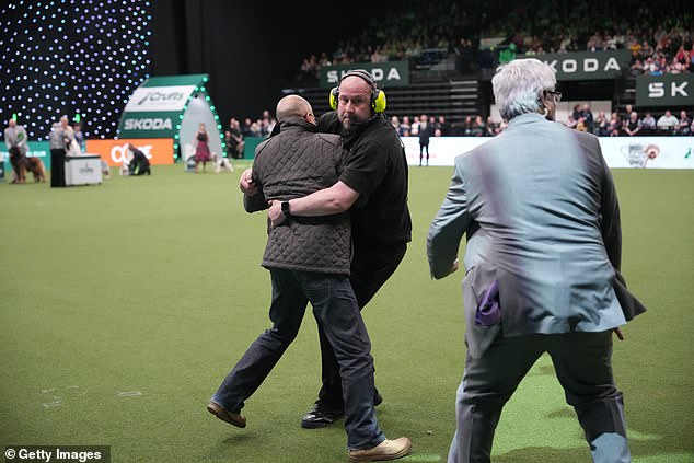 Protesters have clashed with security guards after they stormed the Crufts dog show