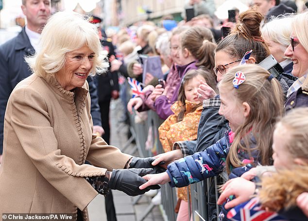 Queen Camilla meets well-wishers during a visit to the farmers' market in The Square, Shrewsbury, Shropshire, today.