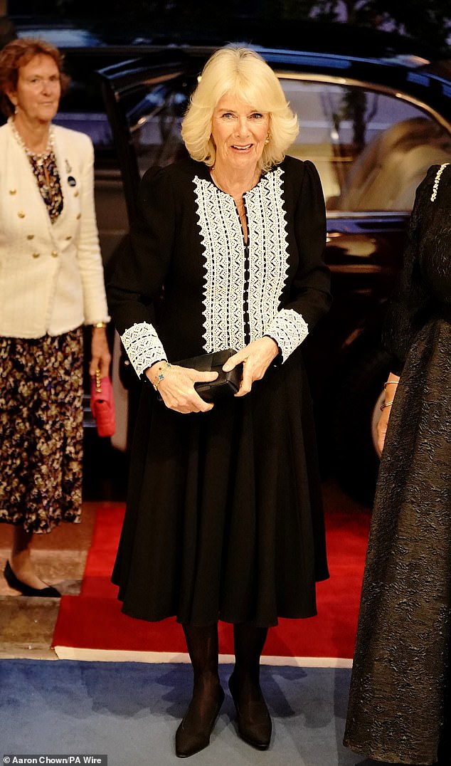 Queen Camilla opted for a black evening dress as she arrived at Marlborough House on Pall Mall in central London last night for a Commonwealth Day reception