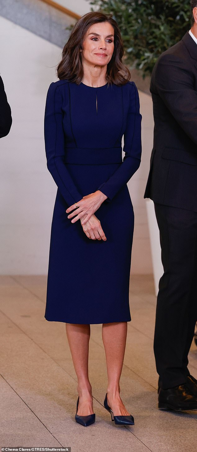 The royal, 51, looked sophisticated in a long-sleeved navy blue dress during a memorial event honoring the nearly 200 victims of the 2004 train bombing in Madrid.